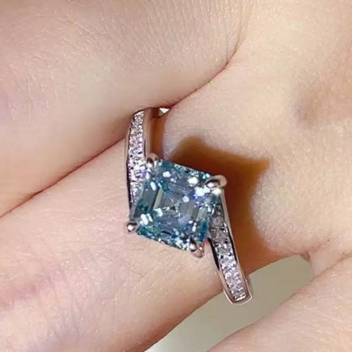 Moissanite solitaire ring worn on the hand