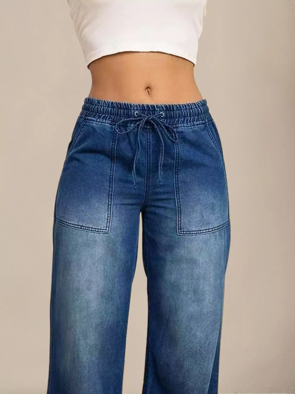 Drawstring tie detail on wide leg jeans