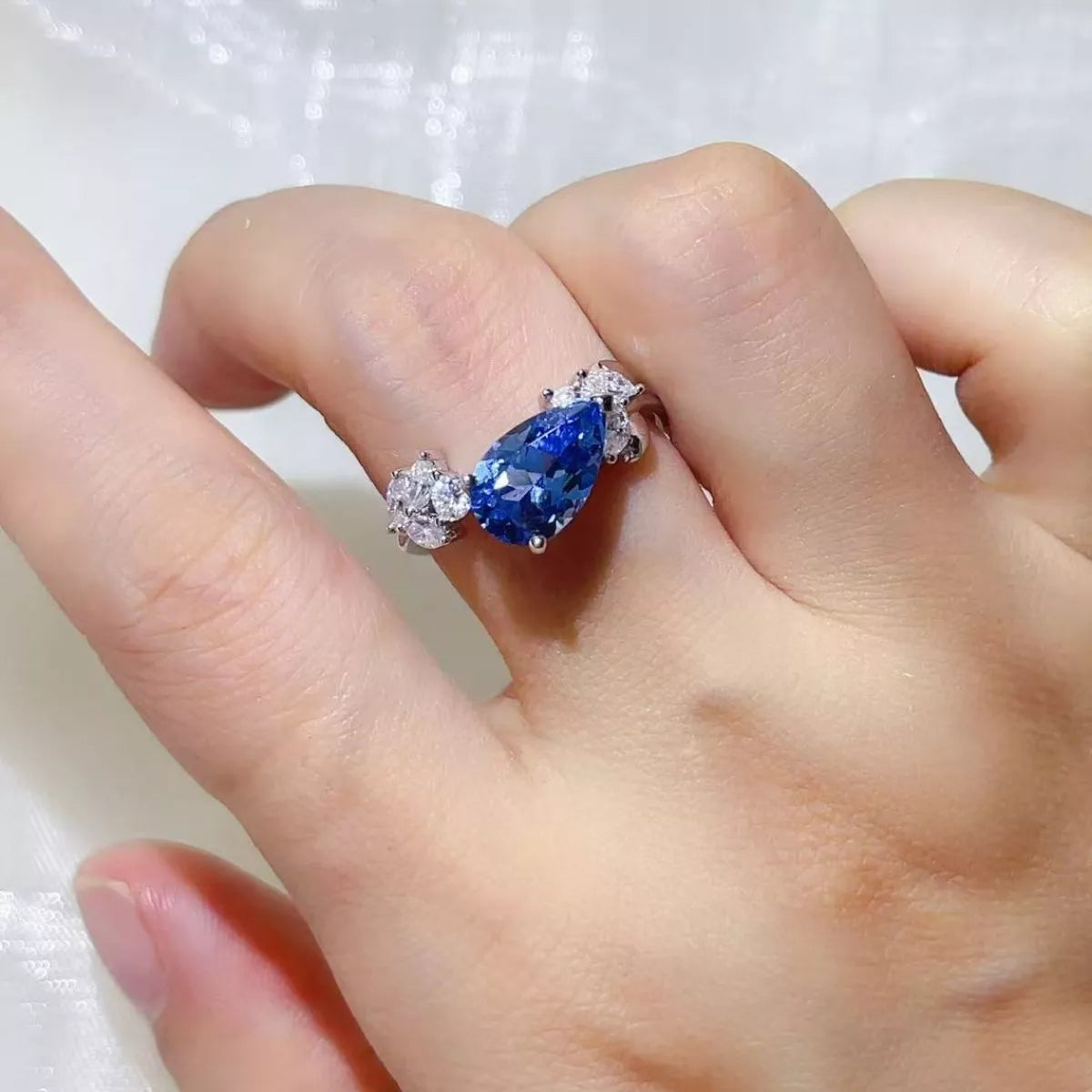 Three carat blue statement ring worn on the hand