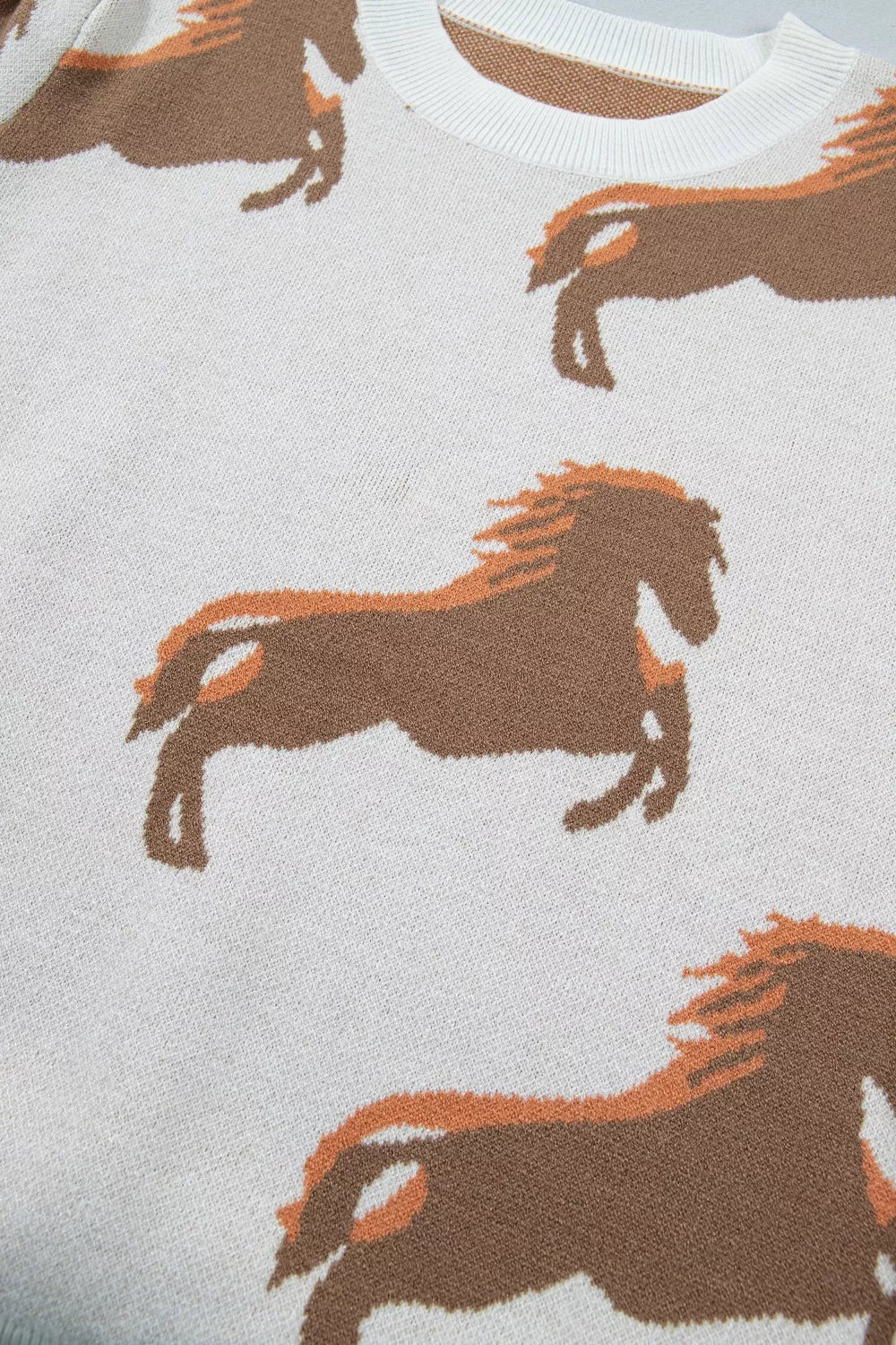 Beige western horse sweater fabric texture