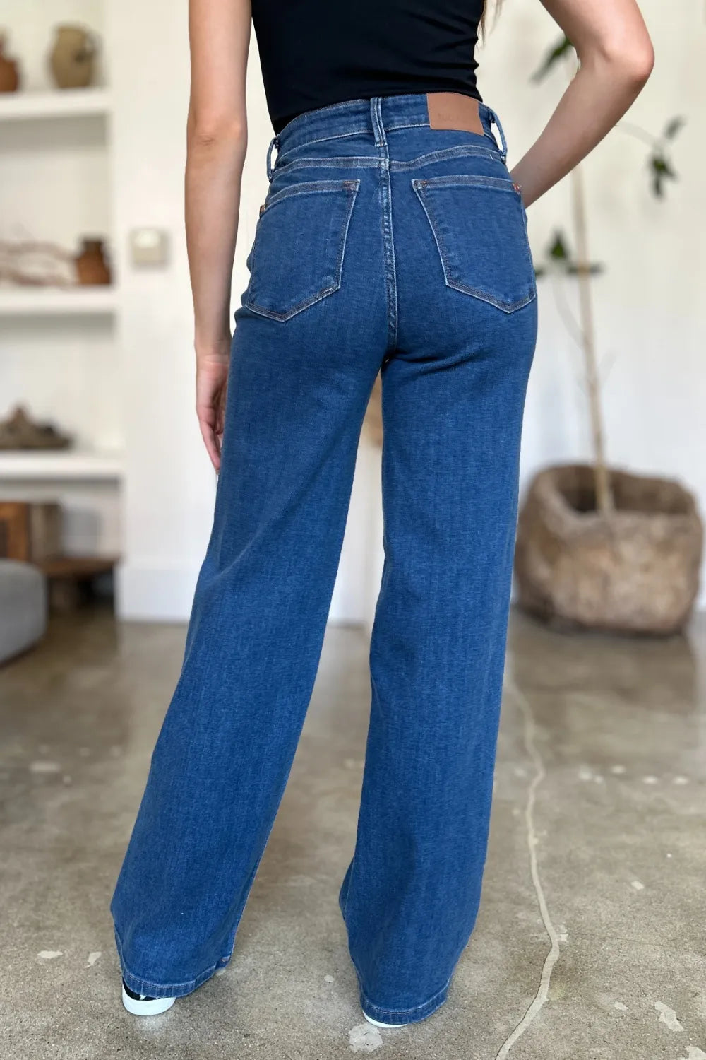 Seated view showing the stretch of the denim