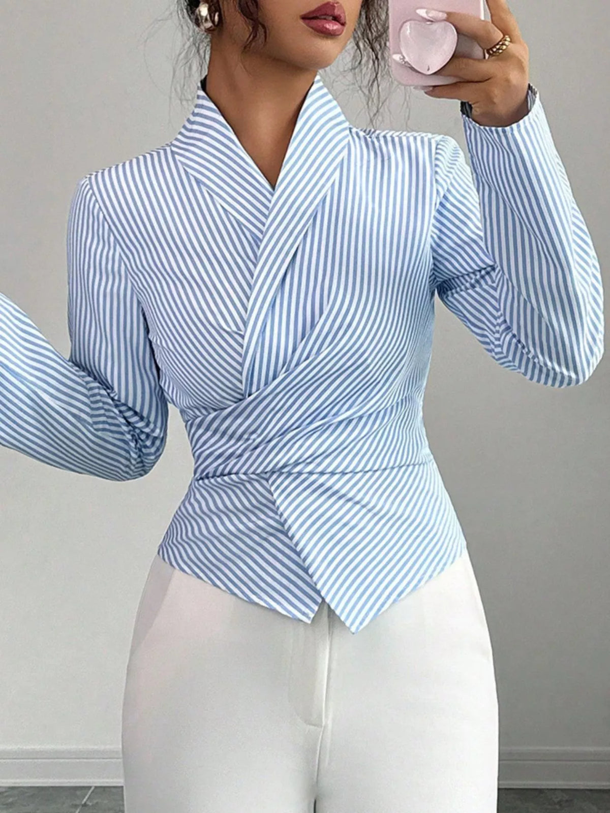 Close view of the tied wrap front detail on the blouse