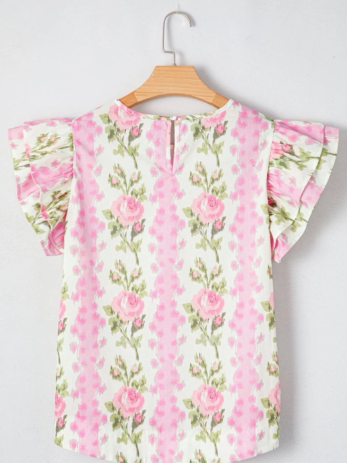 Blush pink floral blouse styled with shorts