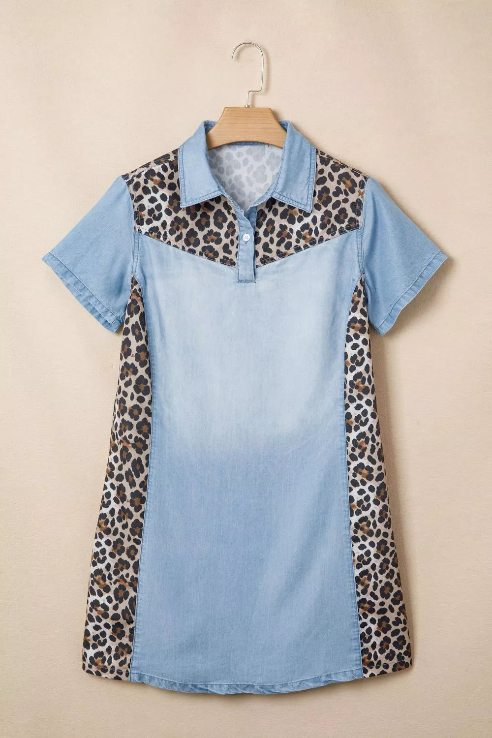 Button detail on the light blue dress