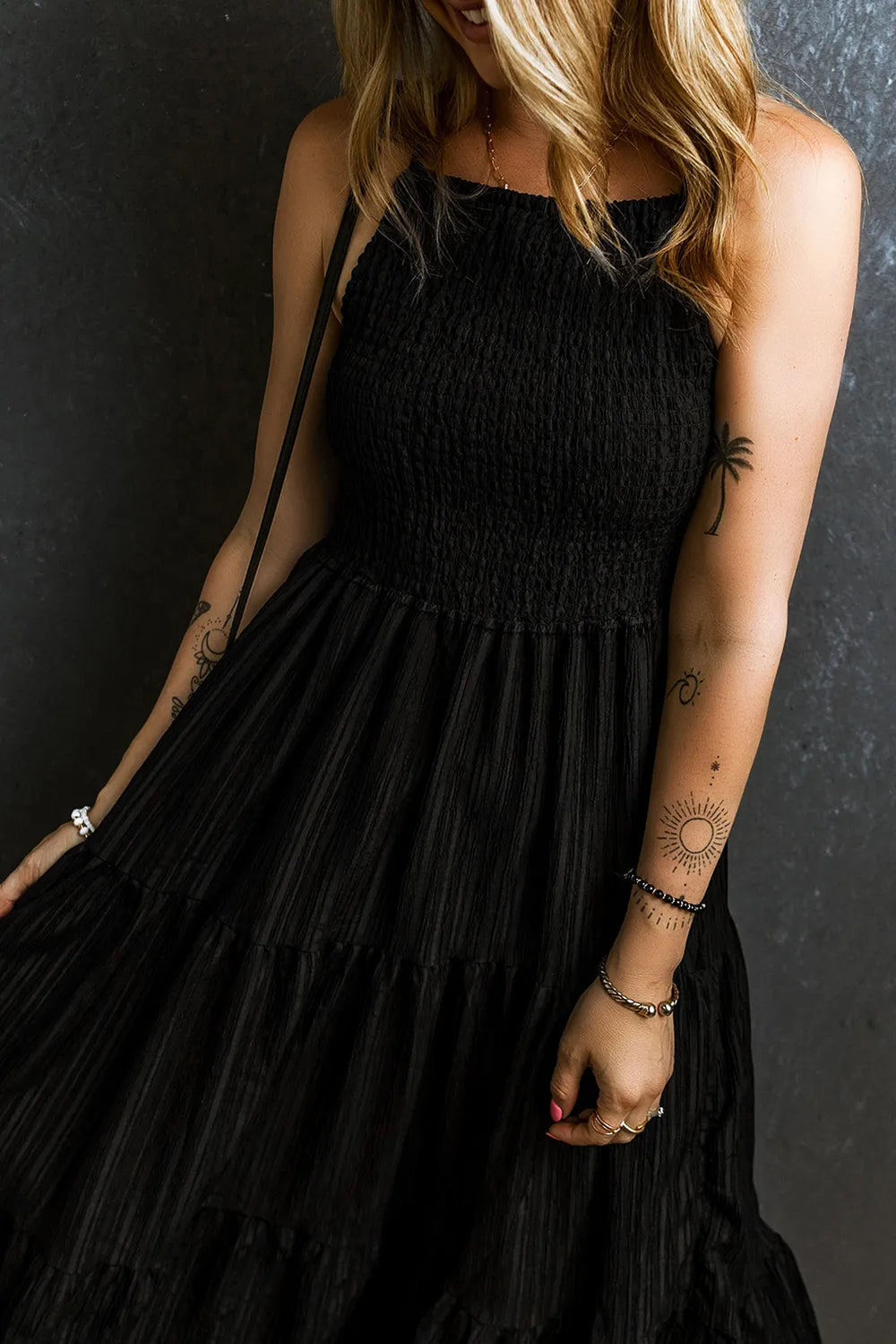 Black smocked tiered spaghetti strap maxi dress, bodice and neckline detail