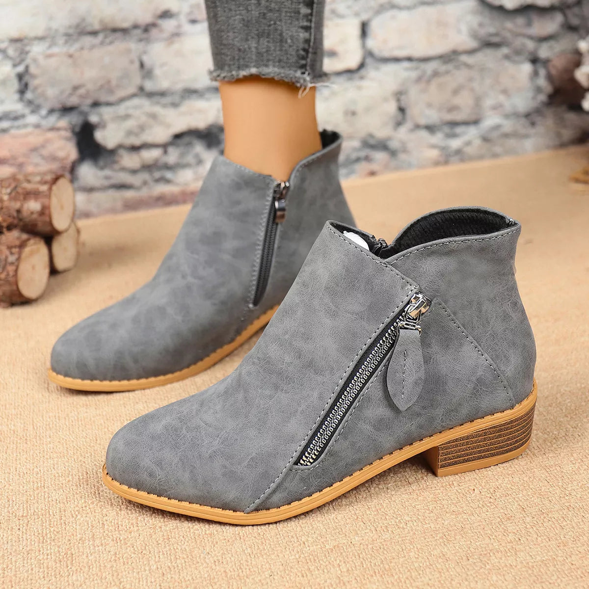 Side zip block heel boots paired with denim