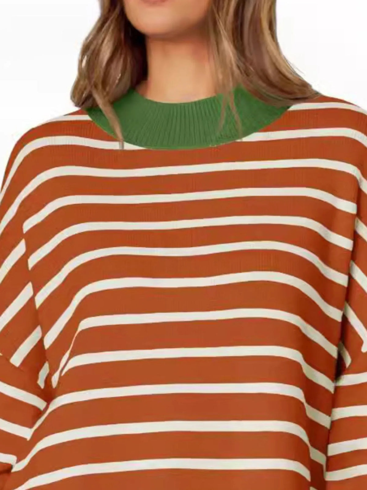 Model wearing striped long sleeve sweater