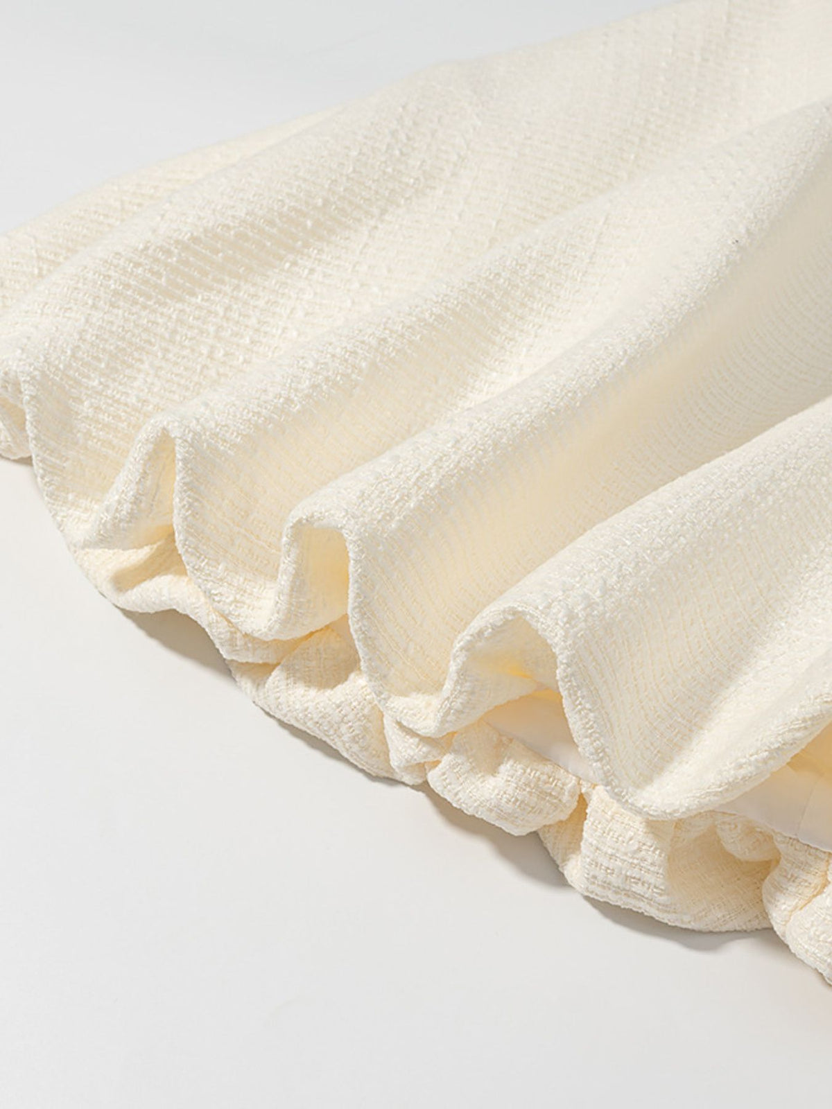 Cream bubble hem skirt movement view