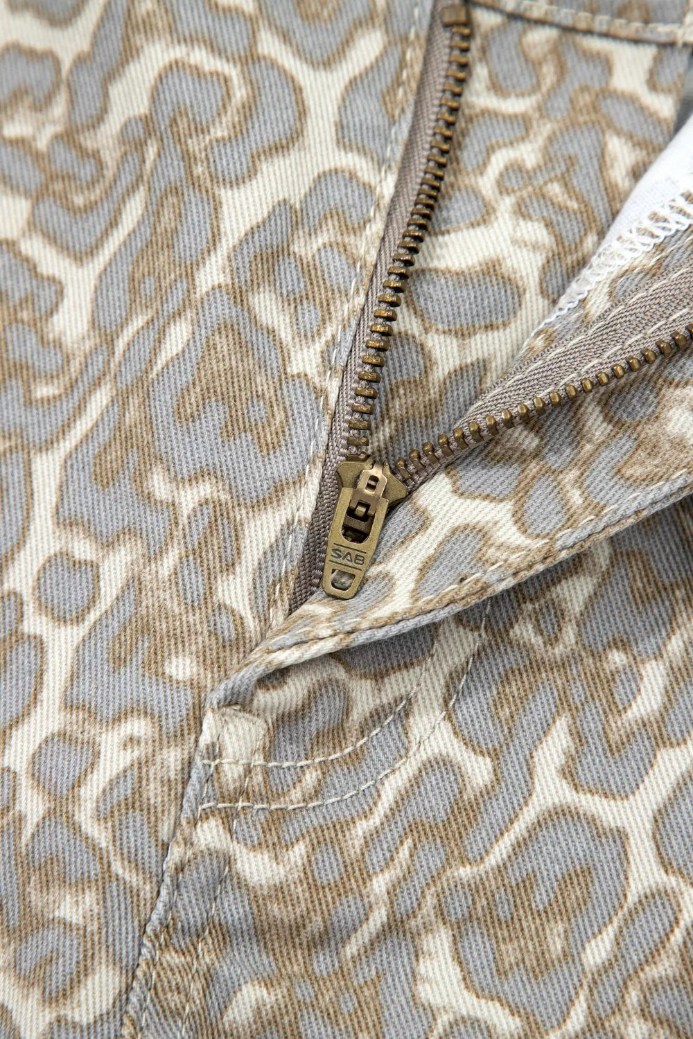 Khaki leopard print raw edge denim shorts front view