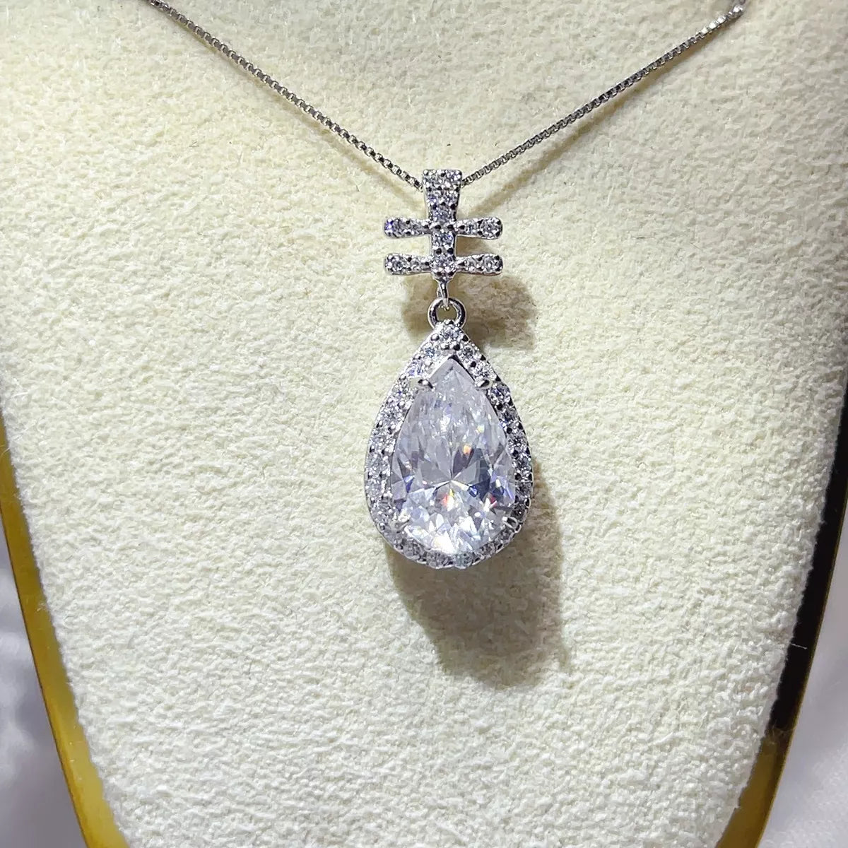 Three carat moissanite stone close up on the silver pendant