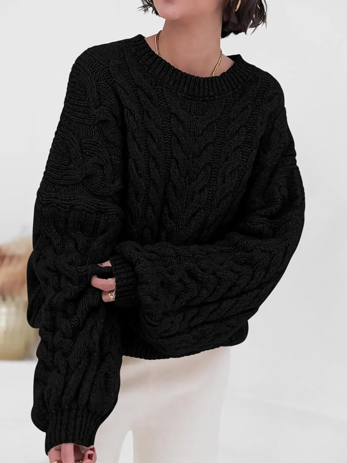 cable knit long sleeve sweater close up texture