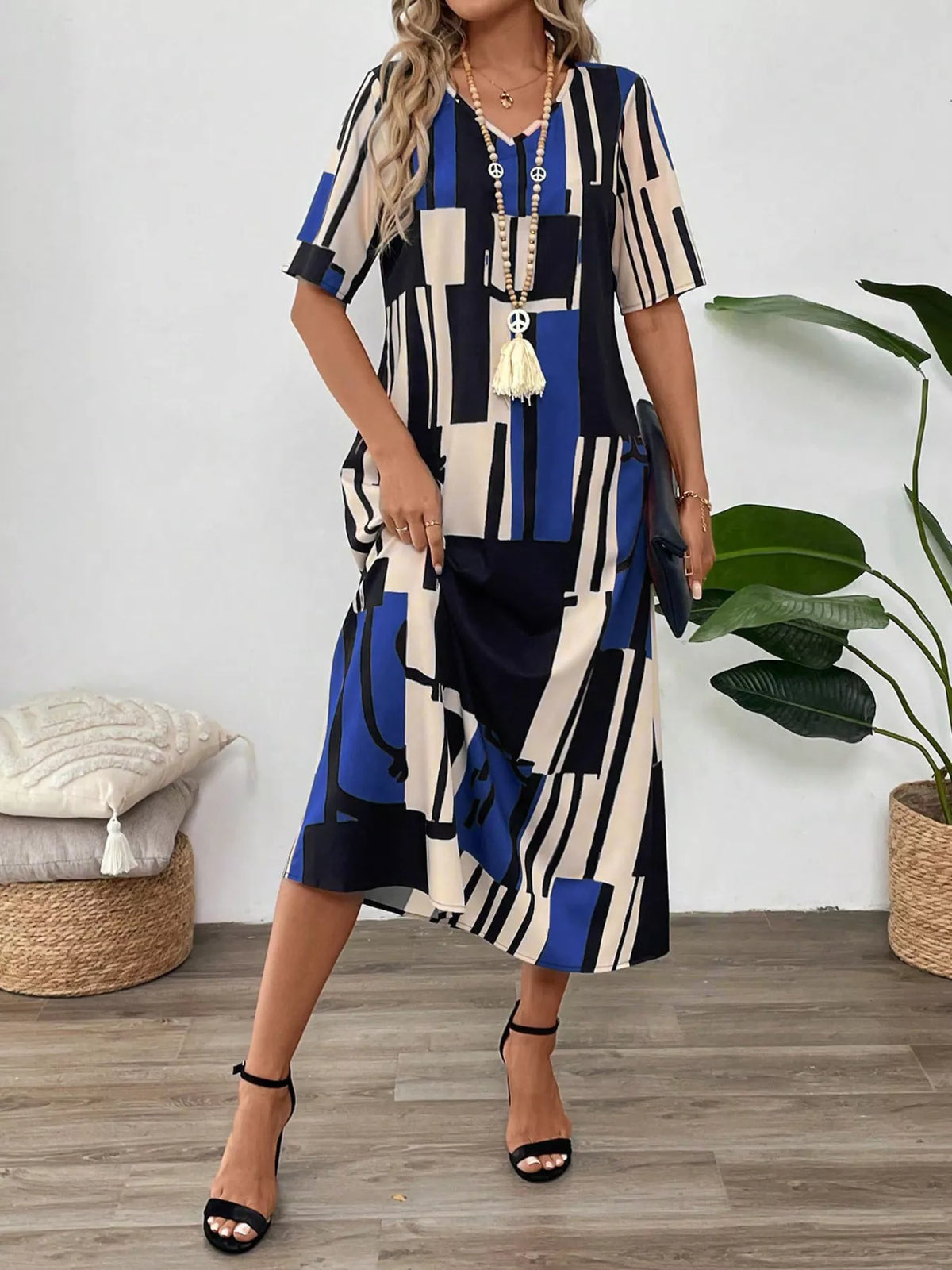 Abstract geometric print v neck midi dress detail view