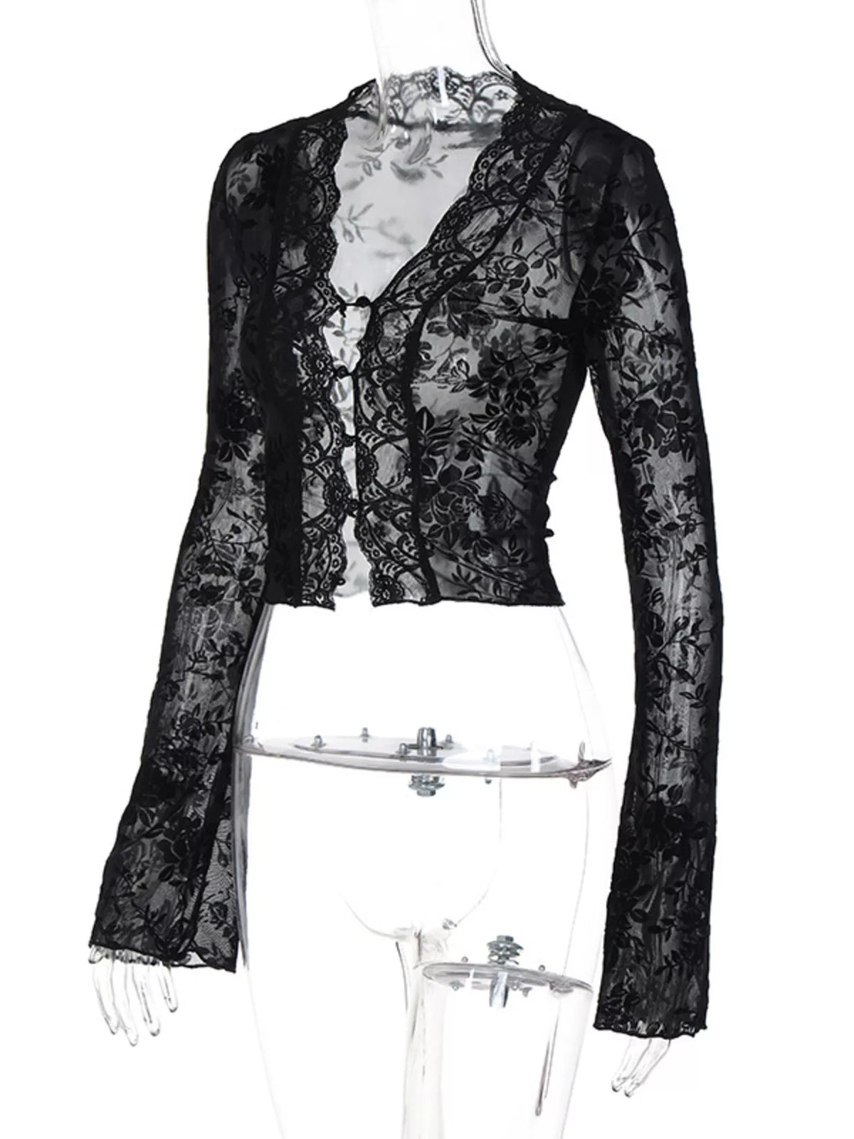 Cropped hem detail of the sheer lace top