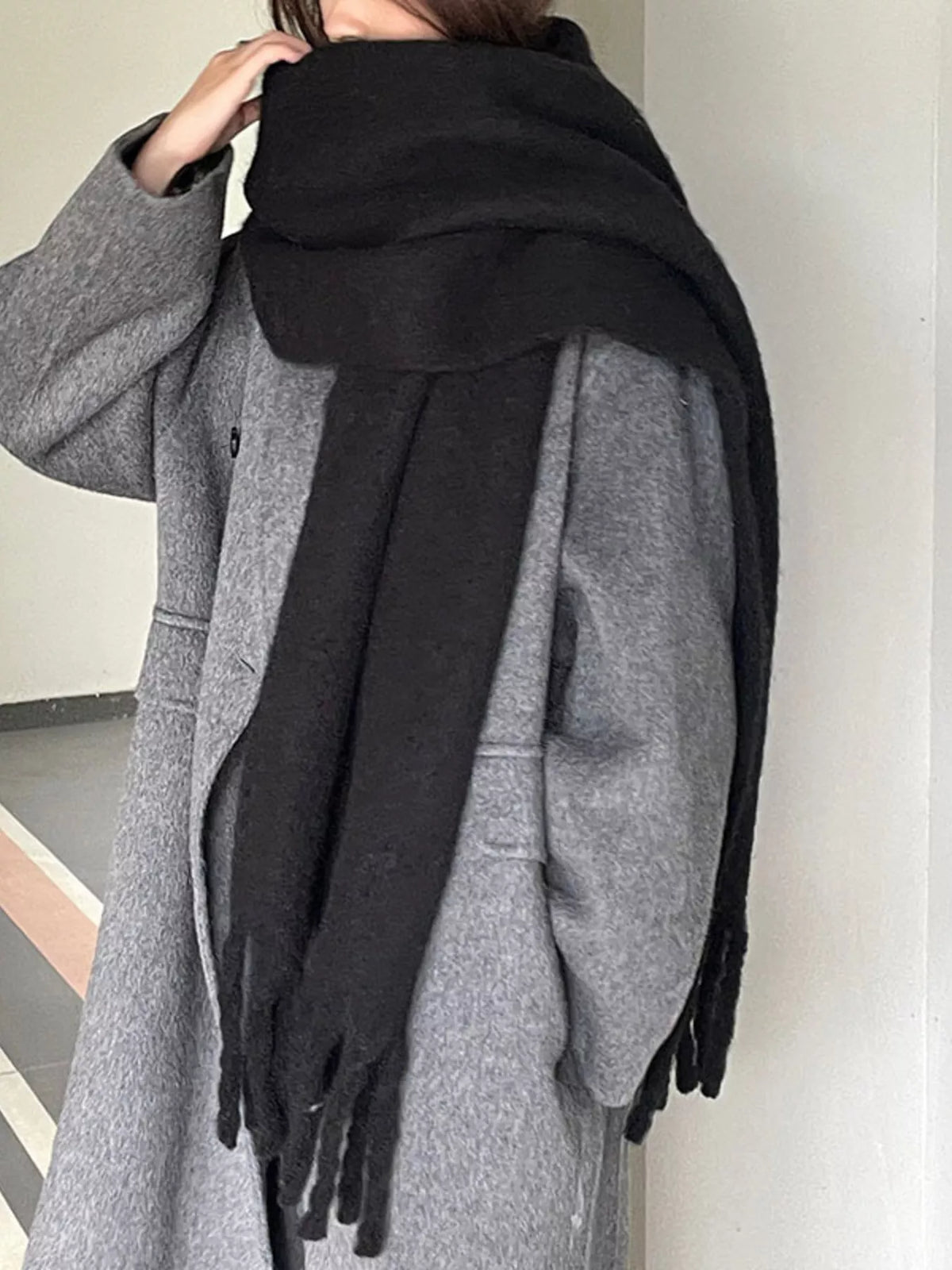 Solid color fringe scarf draped styling