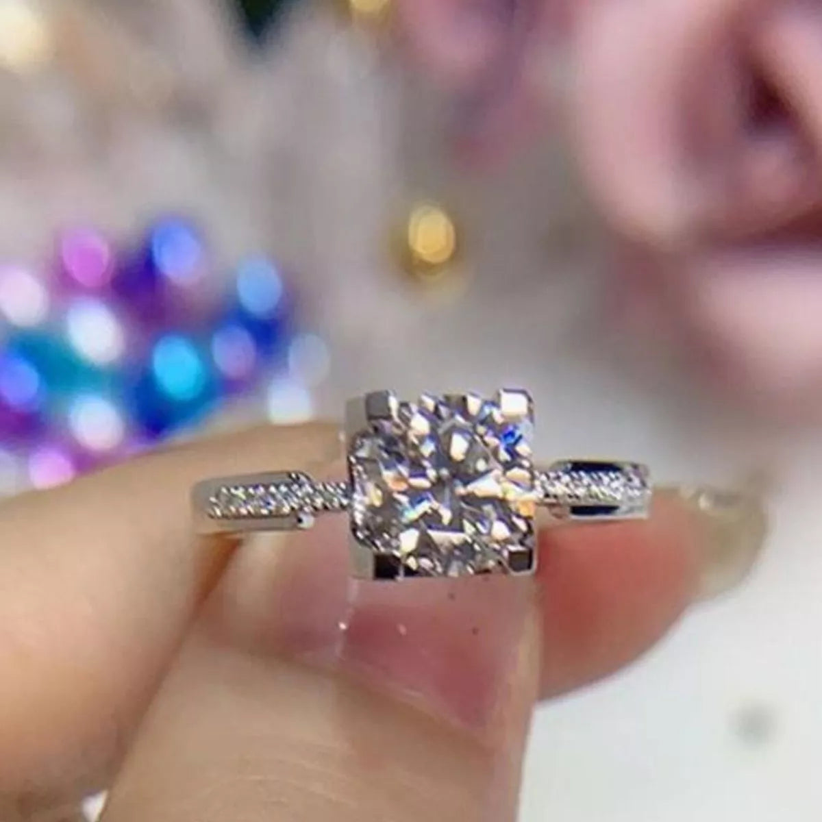 Adjustable silver ring band shown open