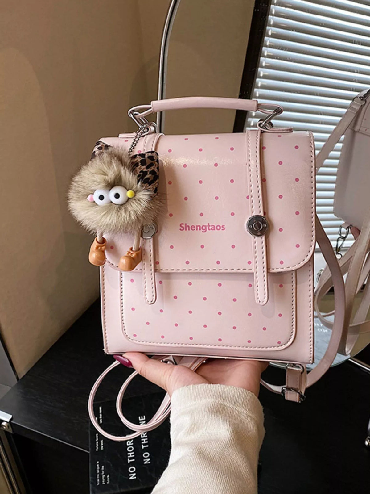 Blush pink polka dot mini backpack side profile