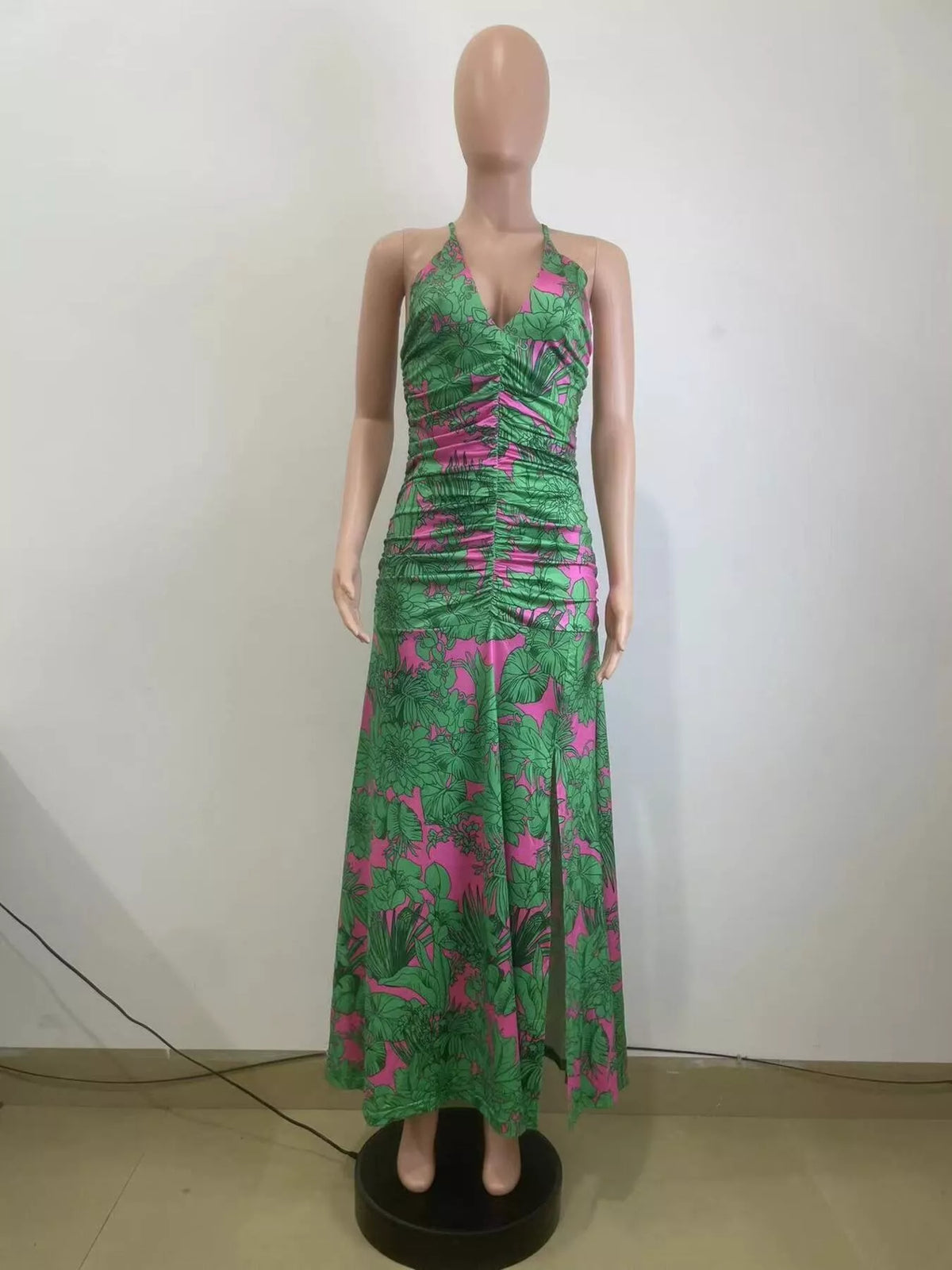 Side view showing the slit on the green halter dress