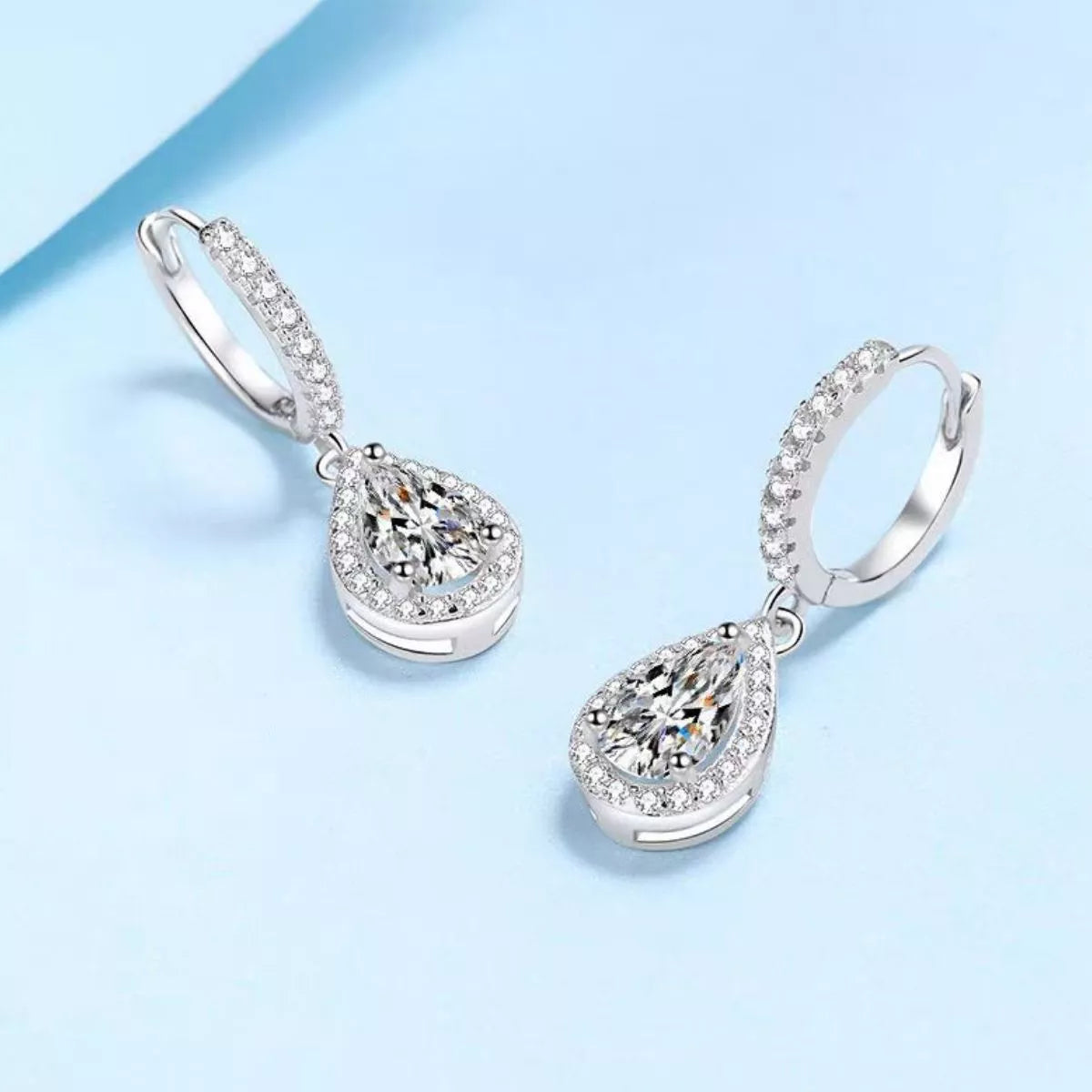 Moissanite hoop teardrop earrings shown as a pair