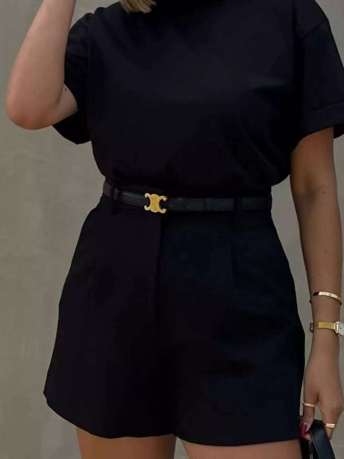Pleated shorts shown on a model