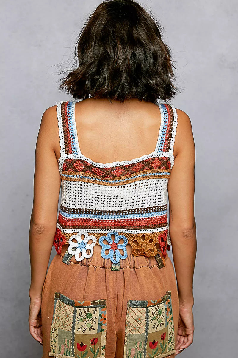 Boho orange crochet crop top styled with denim