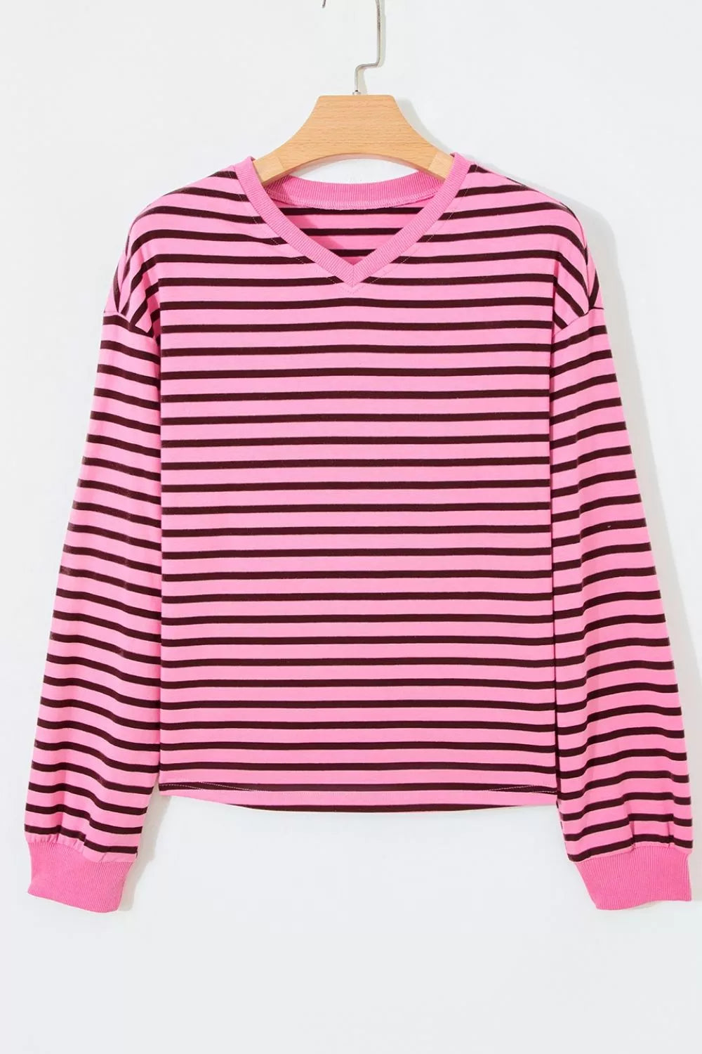 Three quarter view of the fuchsia pink striped top