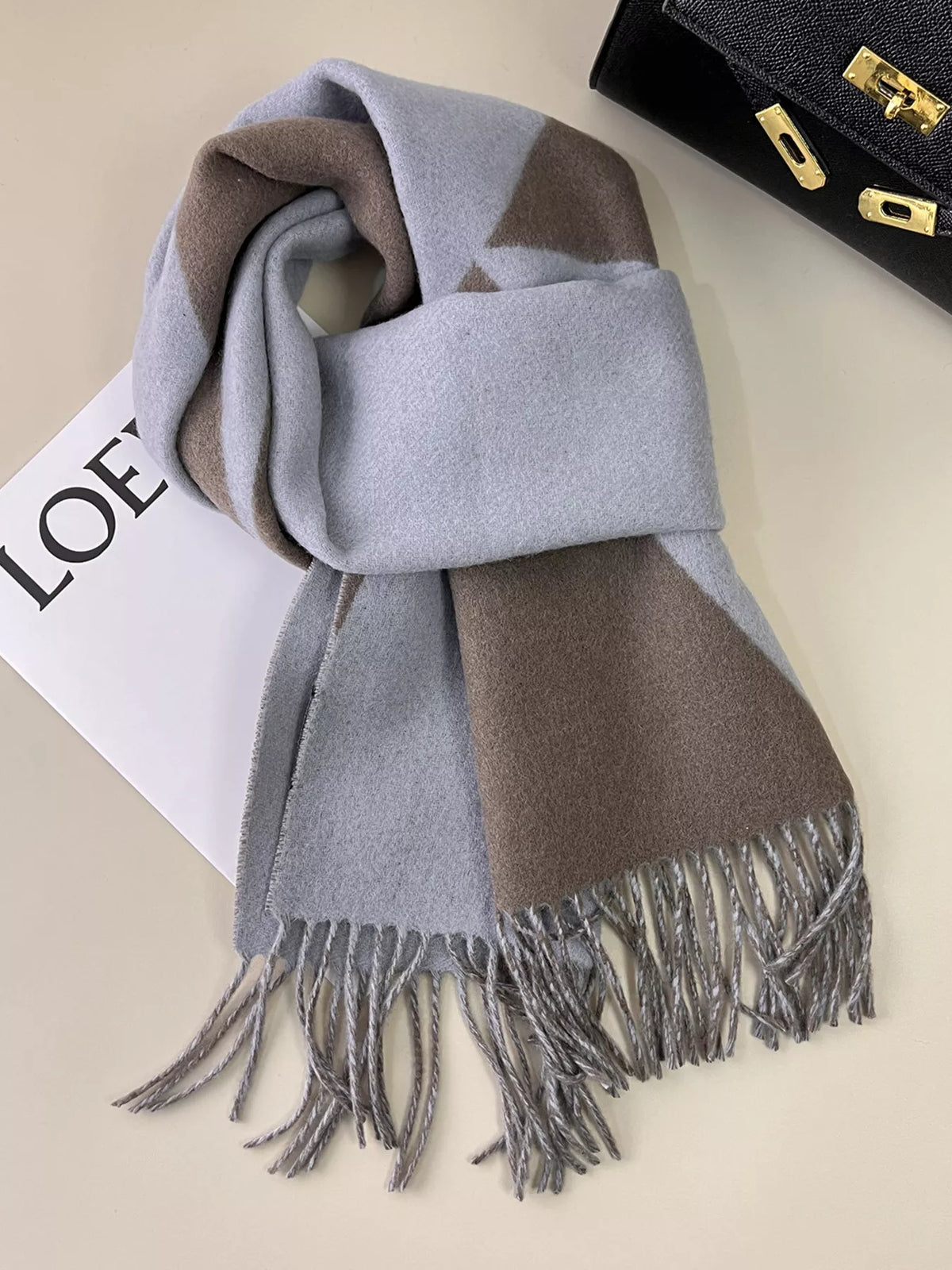 Fringe scarf looped for a cozy layered look