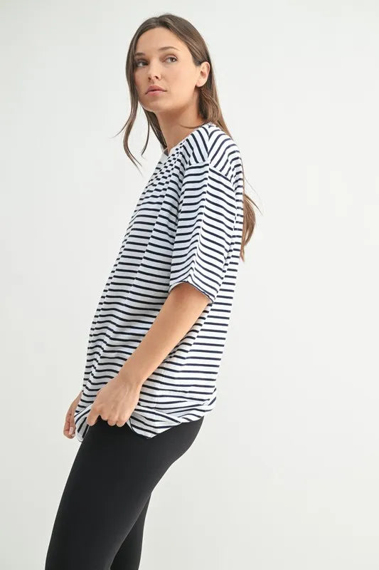 White and navy striped top styled with shorts