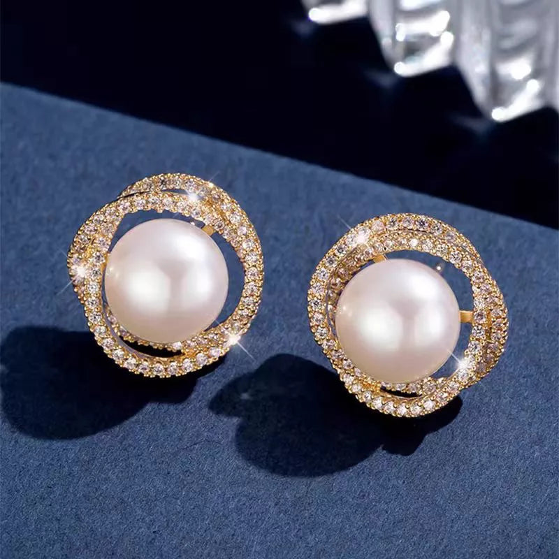 Pearl stud earrings on ear