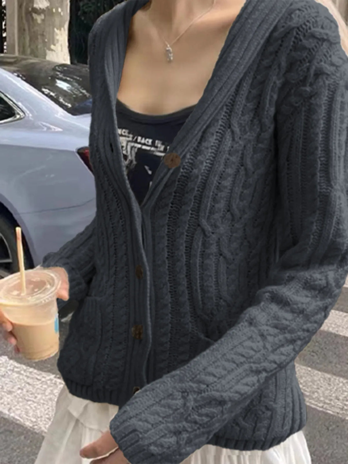 cable knit button up cardigan seated styling view