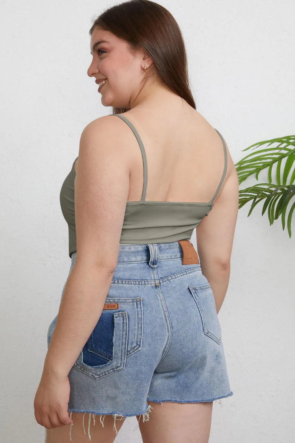 Close up of the round neckline and strap detail