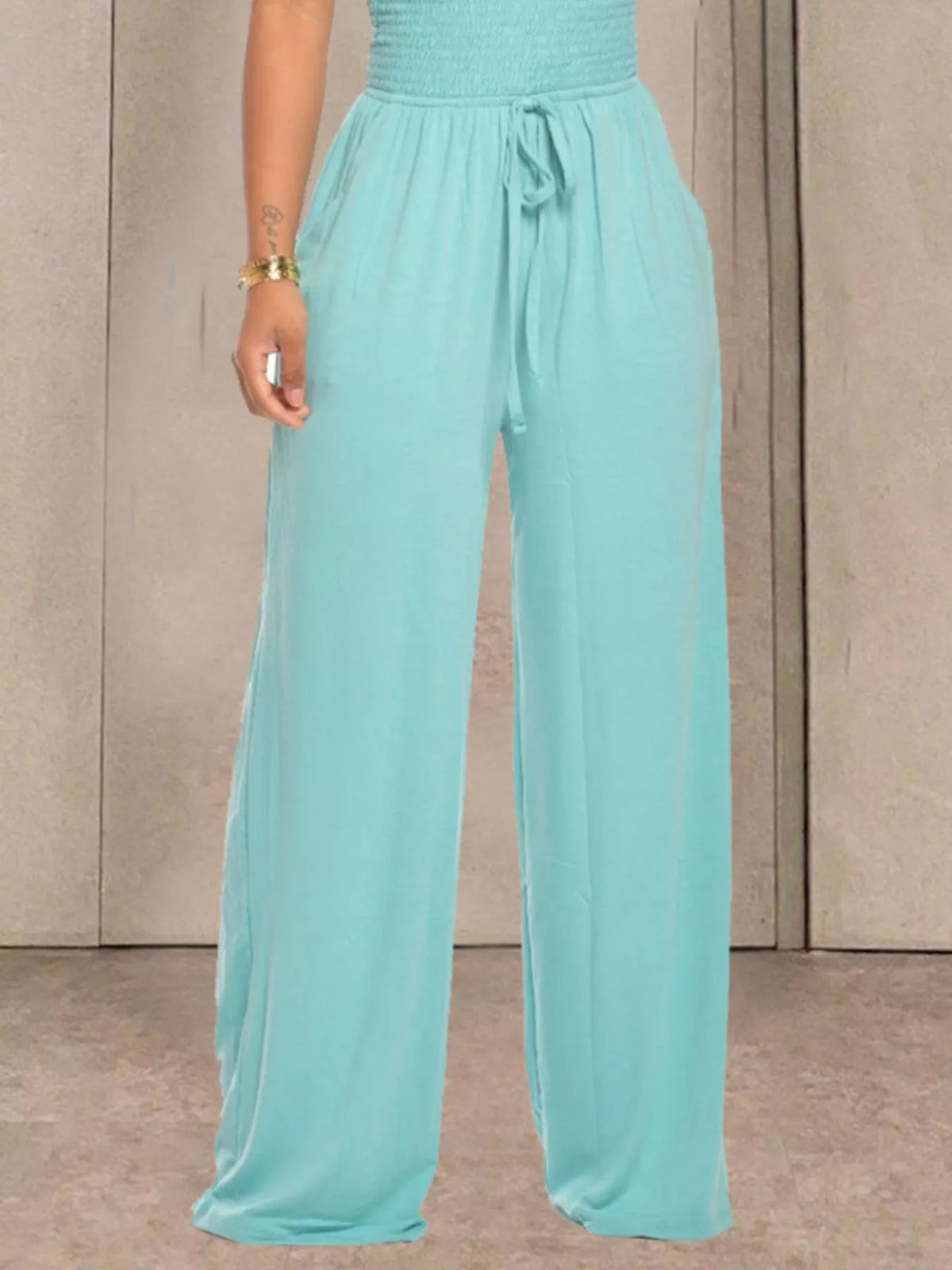 Apricot strapless smocked wide leg jumpsuit front view