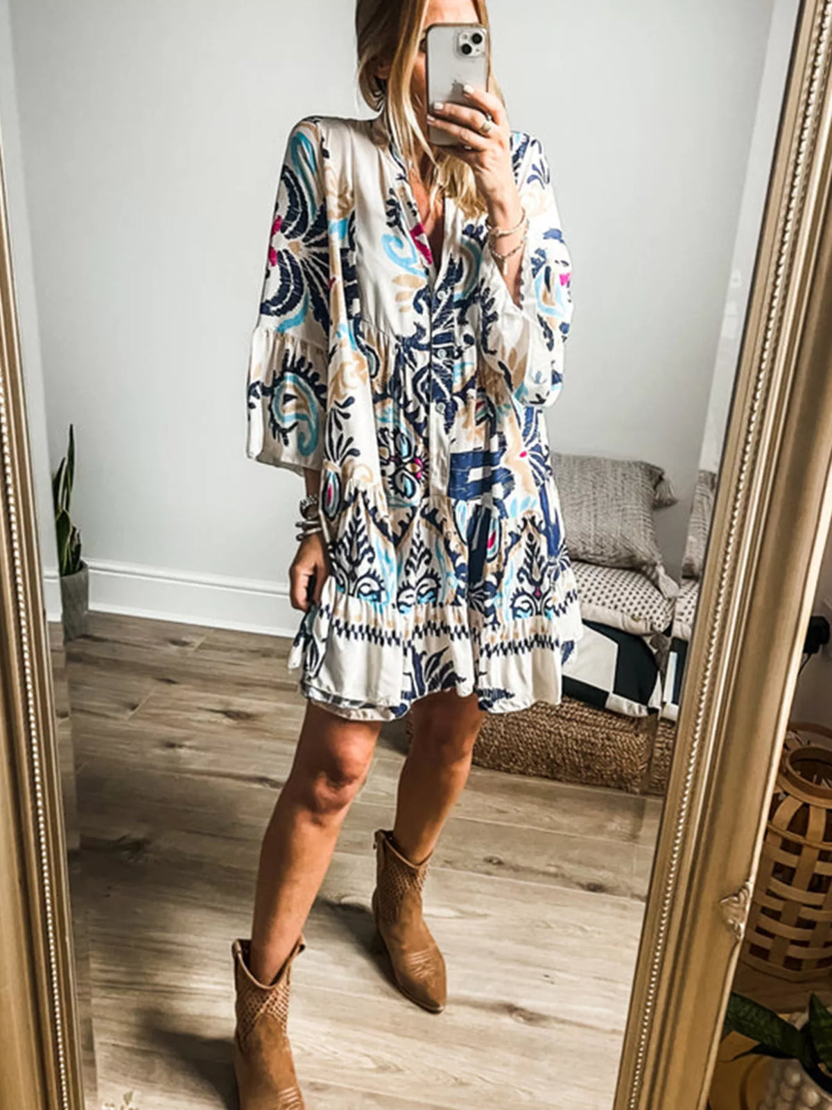 Close up of the buttoned neckline and bohemian print