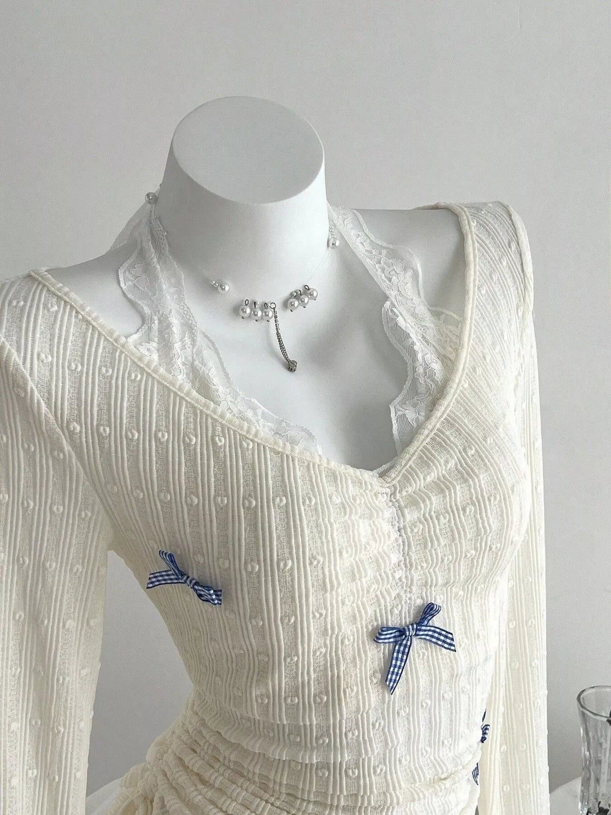 Bow detail on the front of the long sleeve top