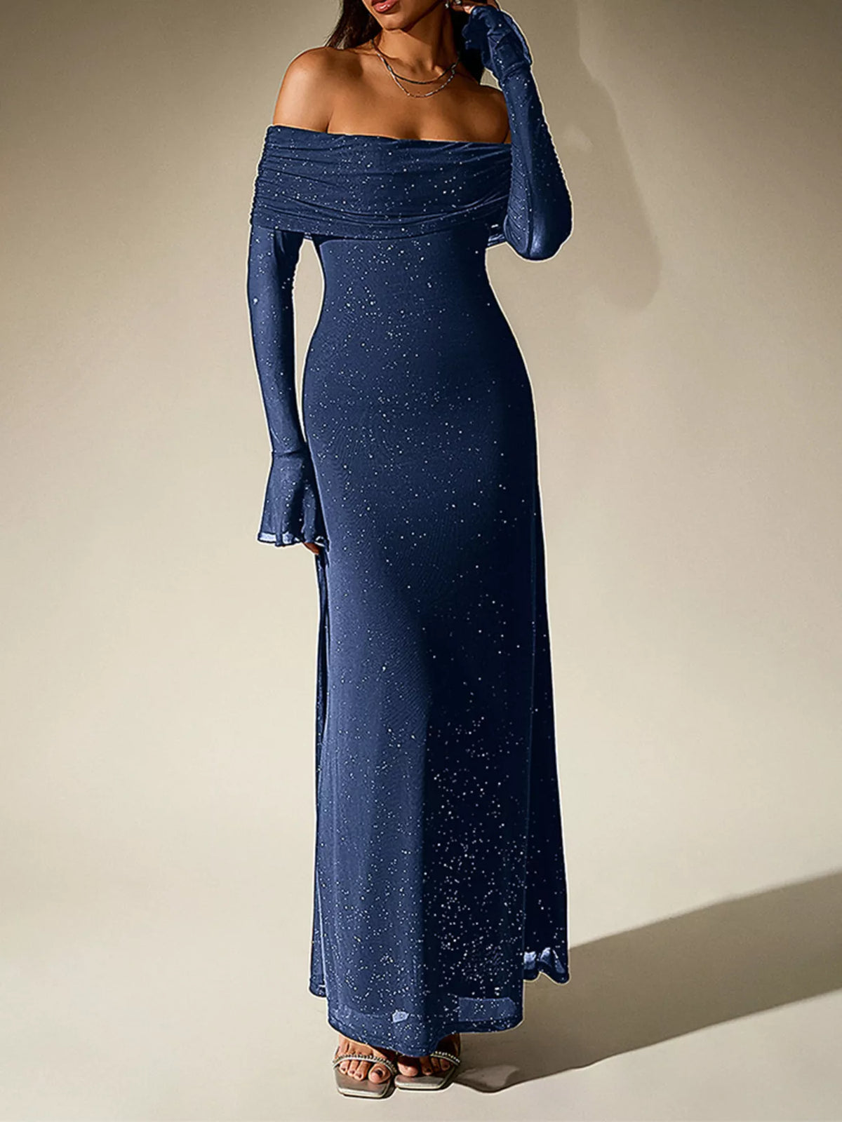 glitter off shoulder maxi dress seated pose