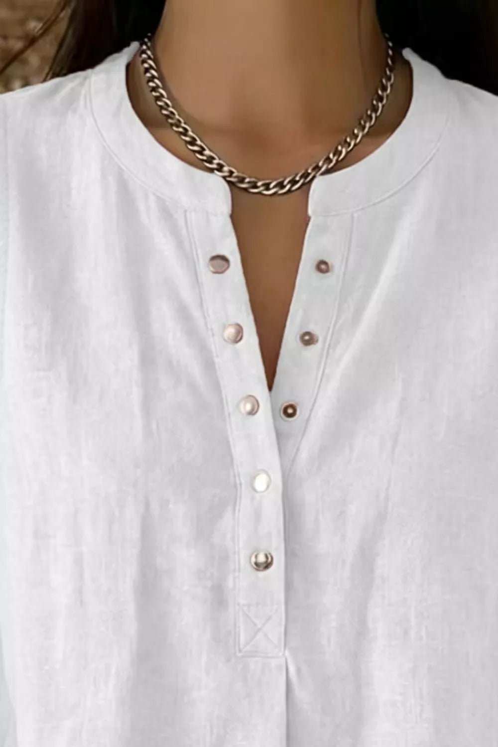 Detail of snap placket on sleeveless top