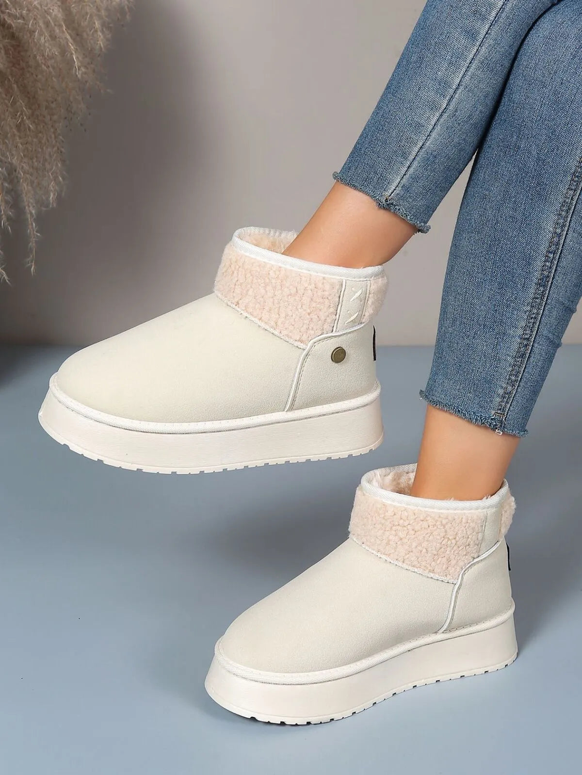 Sherpa lined platform winter boots styled with denim