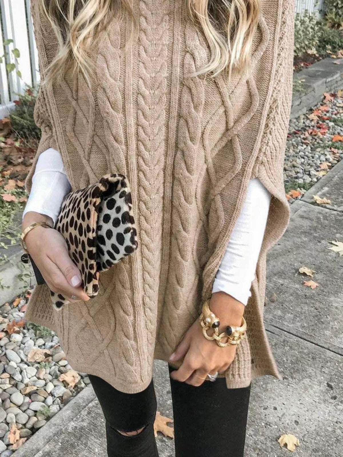 Chunky cable knit turtleneck poncho three quarter view