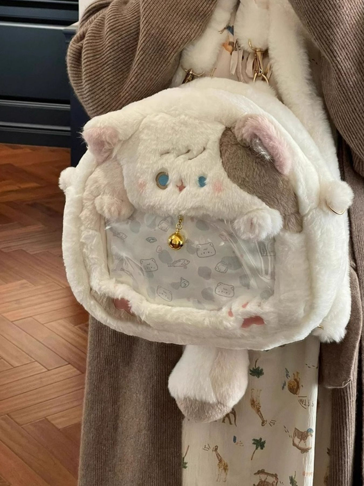 Plush cat backpack side view
