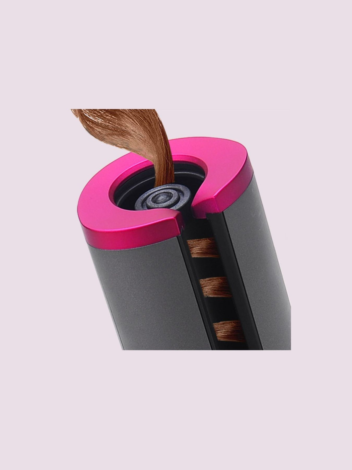 Portable hair curler held in hand
