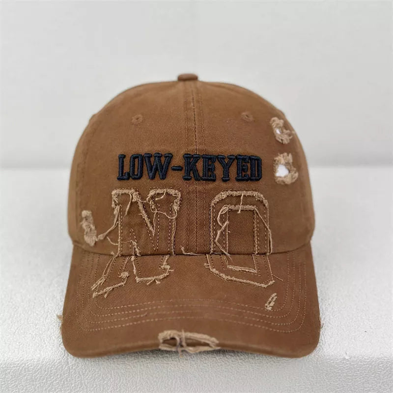 Close up of the frayed distressed finish on the cap