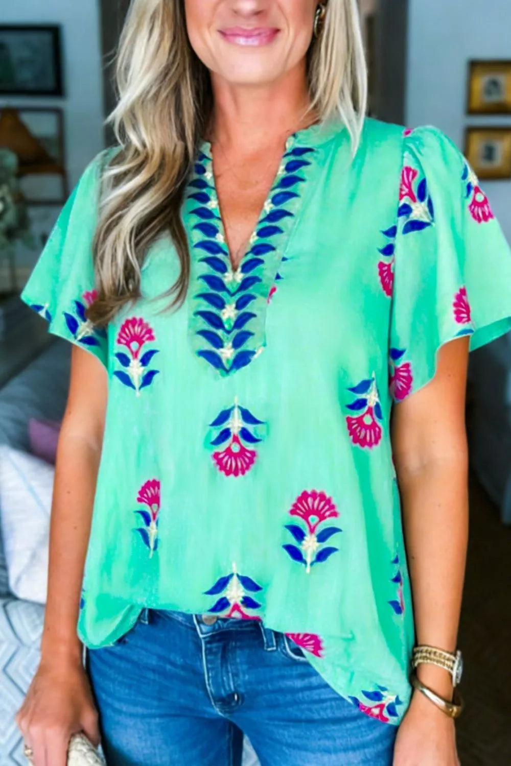 Turquoise floral V neck flutter sleeve blouse styled view