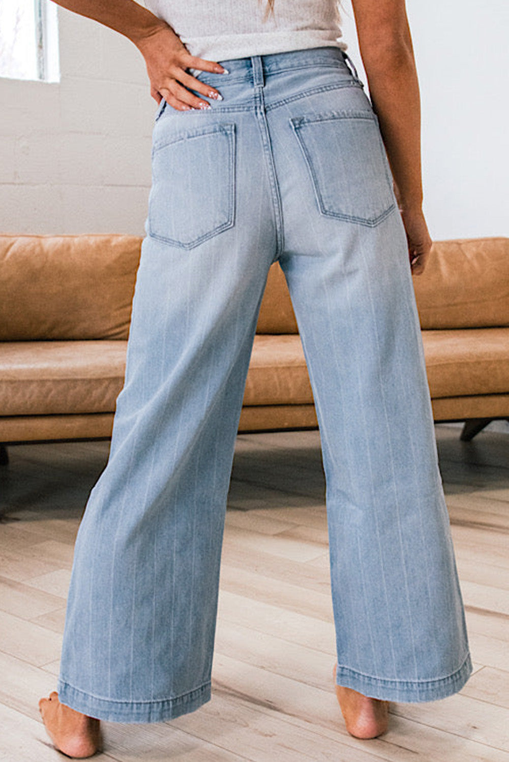 Blue wide leg jeans back view
