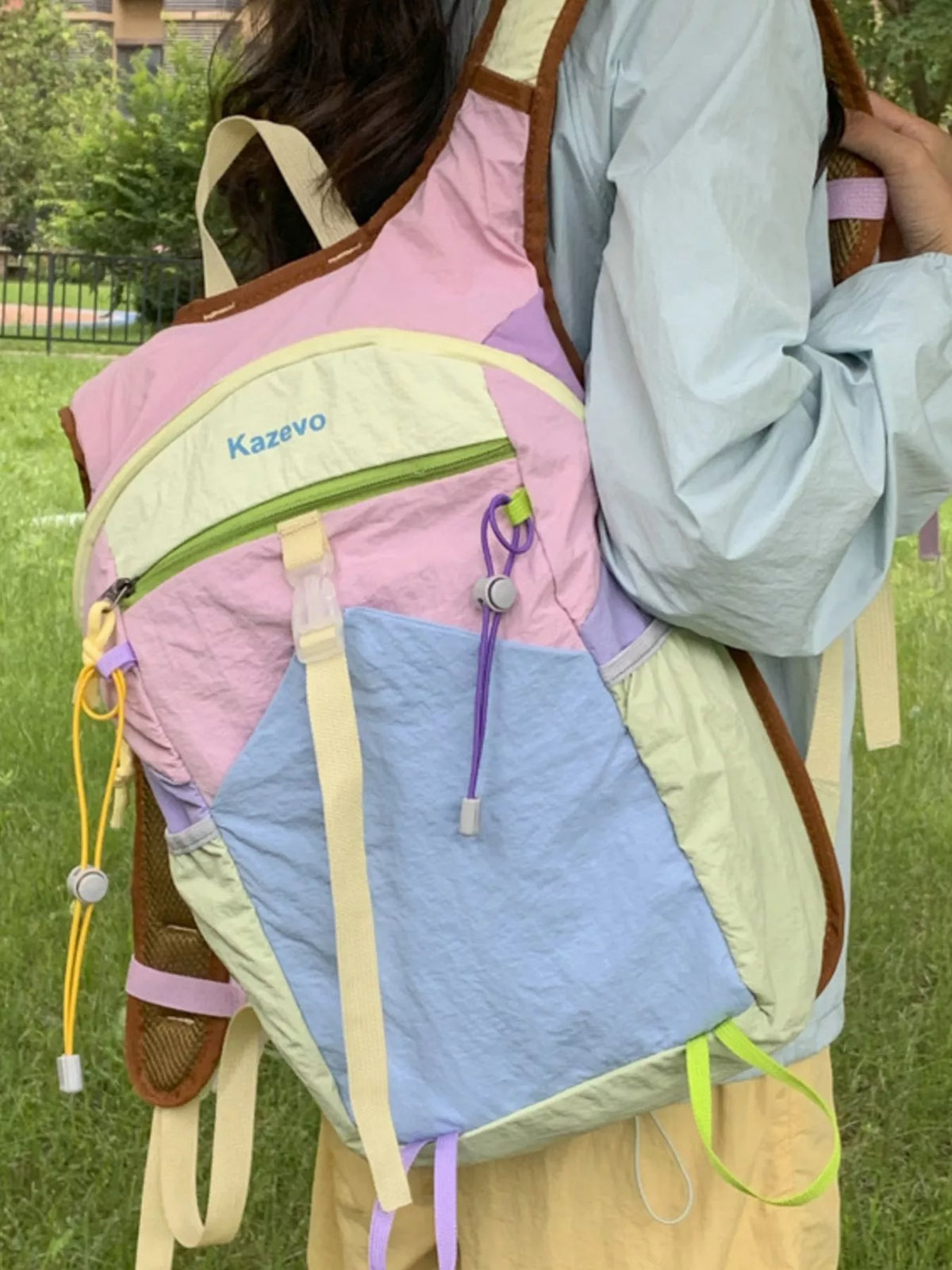 Pastel blue color block backpack worn on the shoulders