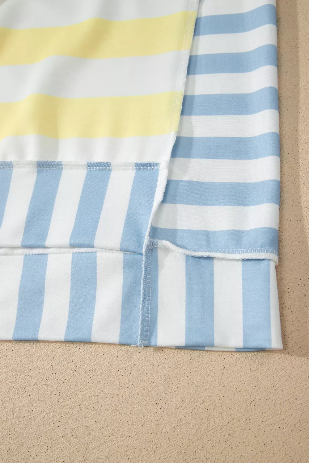 Light yellow striped top, three quarter angle on model