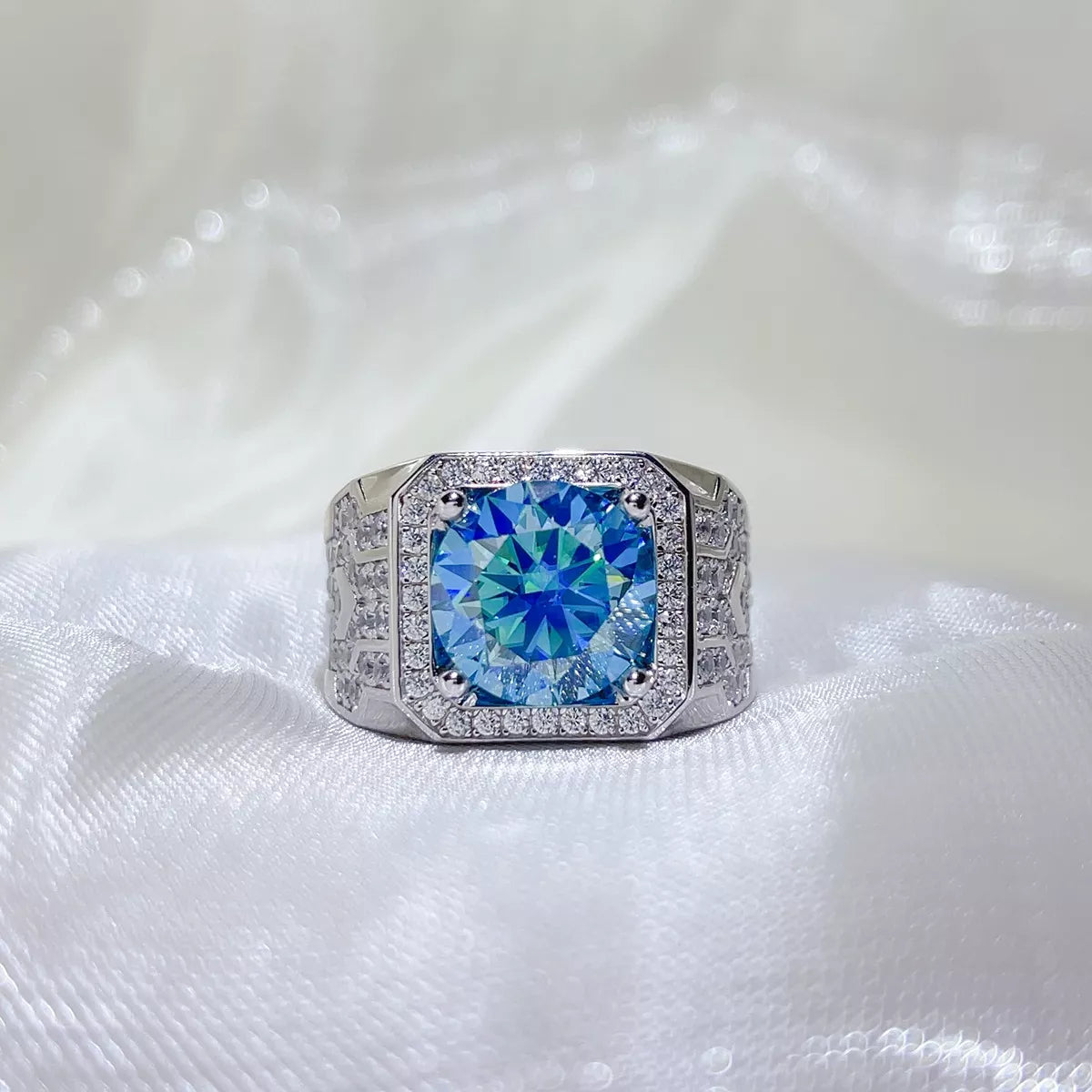 Blue stone ring worn on a hand to show scale