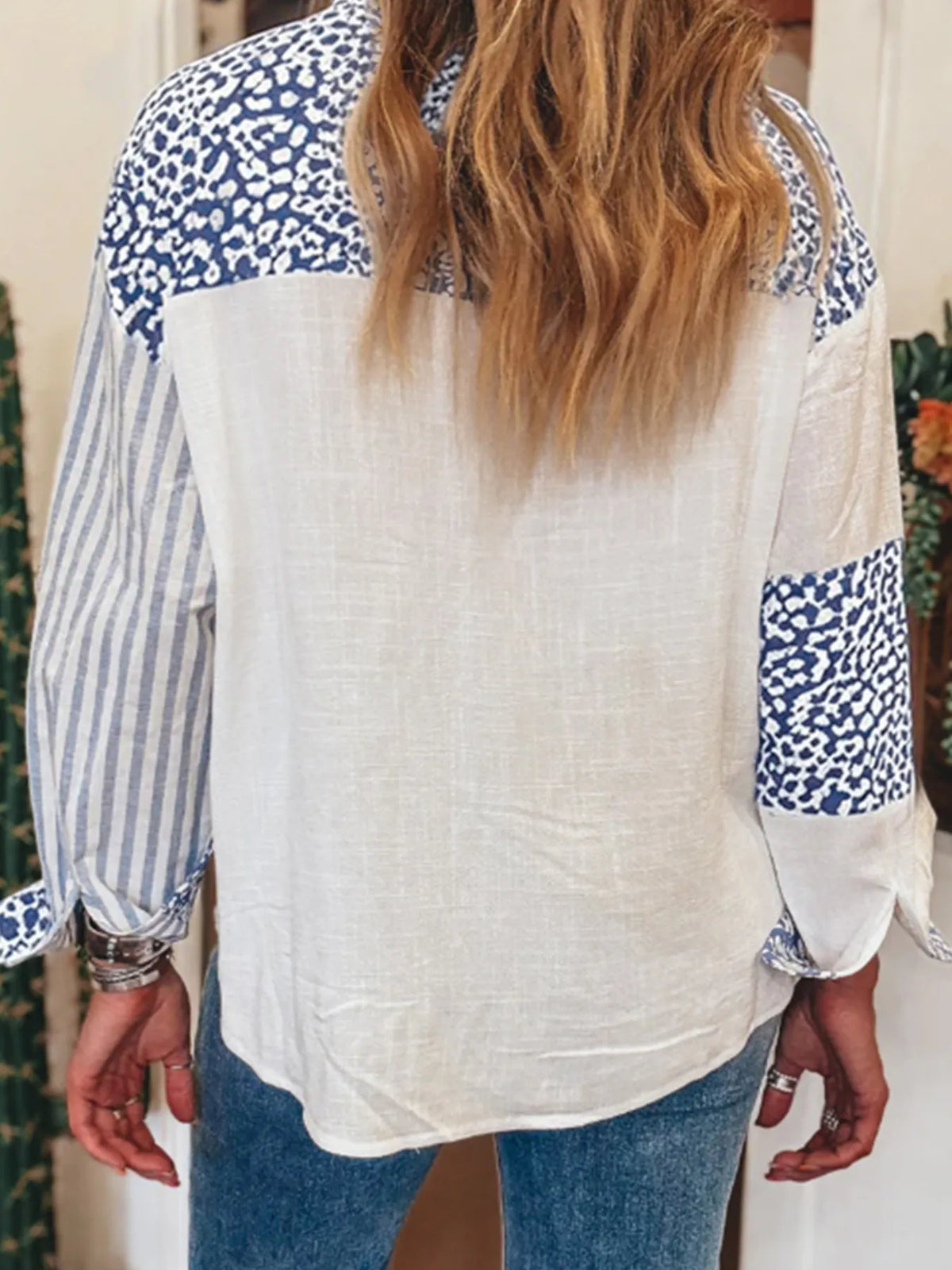 Light blue stripe shirt showing leopard print panel