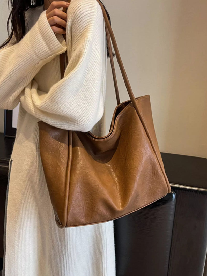 Vintage large capacity shoulder bag in brown front view