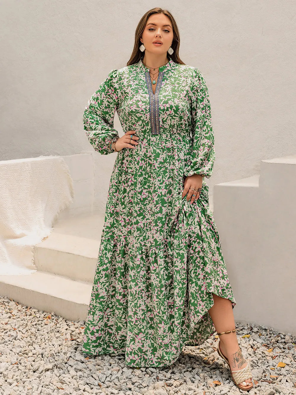 Plus size printed notched neck long sleeve maxi dress close up of the neckline