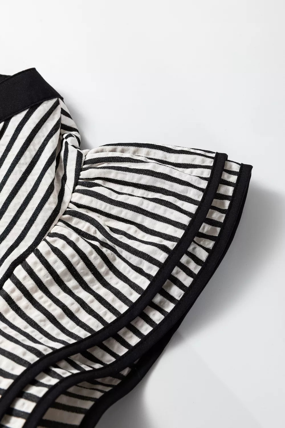 Striped tiered dress fabric close up