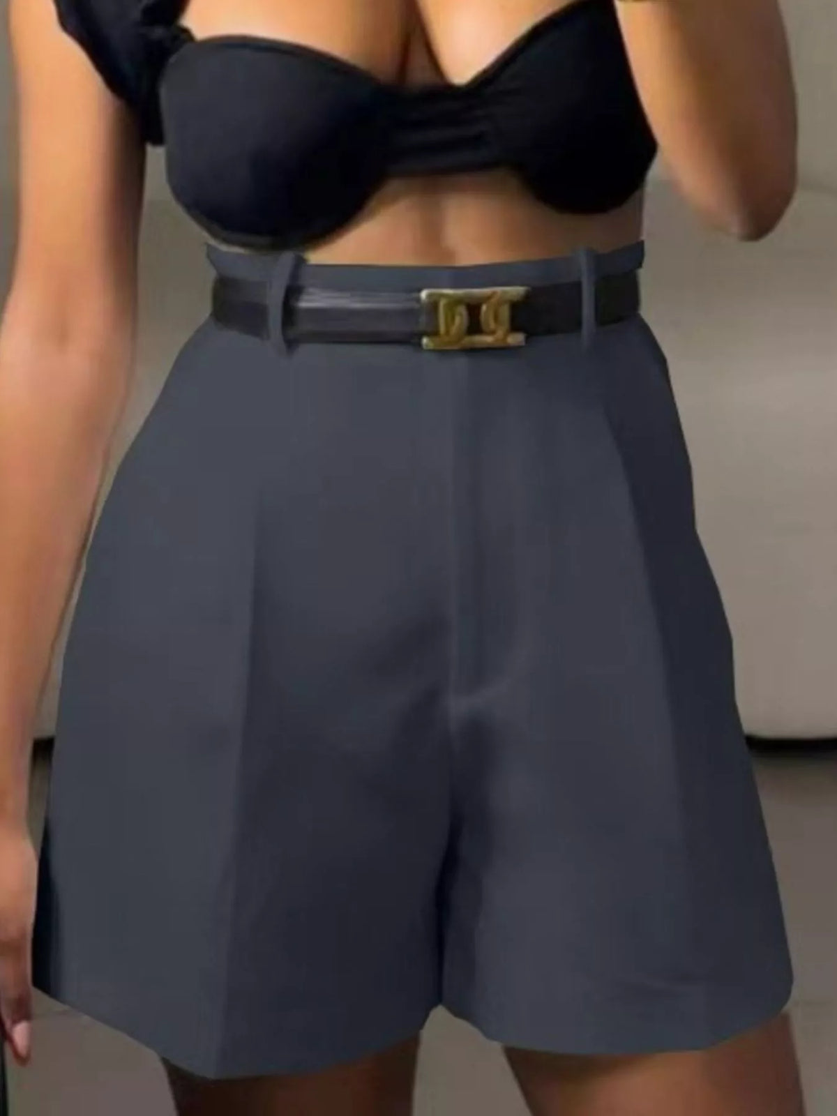 Dark gray pleated shorts waistband detail
